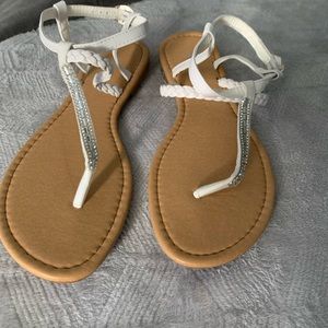 White and brown woman’s Joe boxer sandals